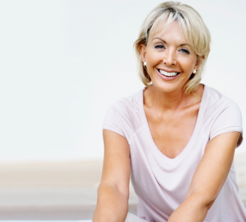 Smiling mature woman with short blonde hair