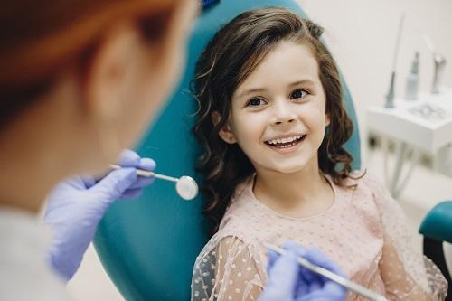 Young patient smiling at children's dentist in Towson MD