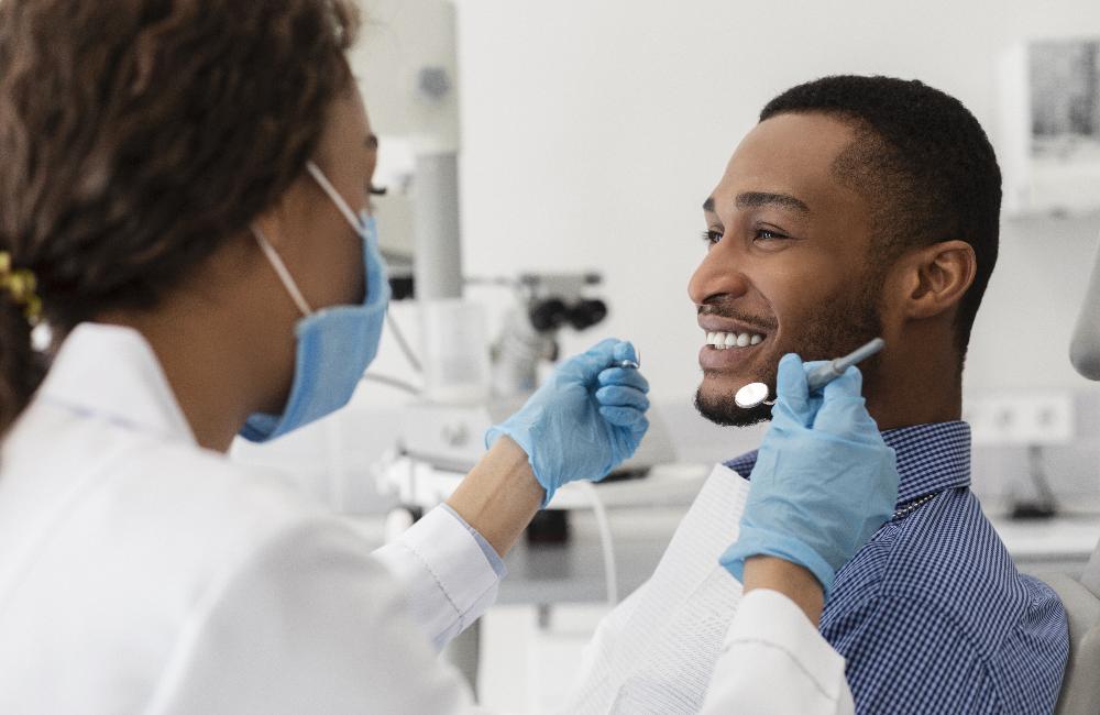 Patient smiling in chair at dentist in Towson, MD