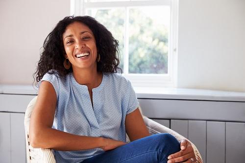 Woman smiling at dentist office in Towson MD
