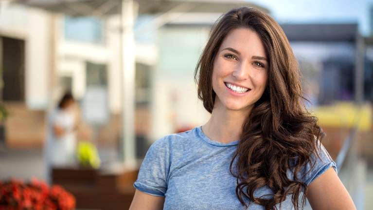 Woman smiling at Druid Hill Park in Baltimore, MD