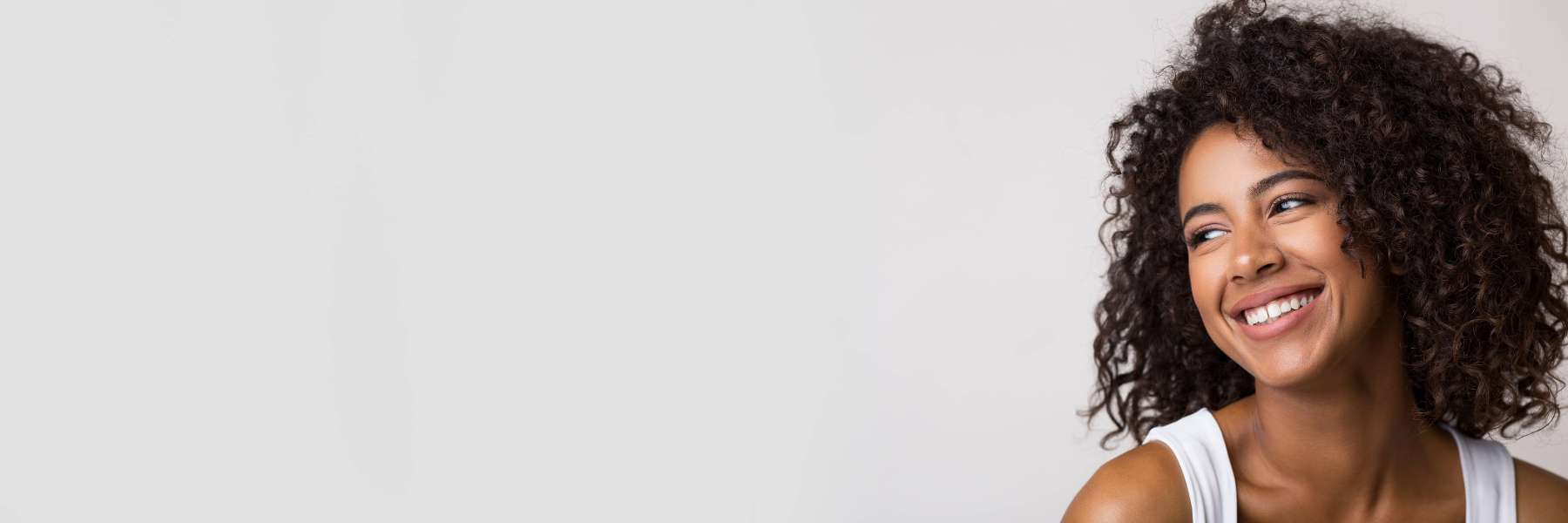 Woman smiling at cosmetic dentist in Towson, MD