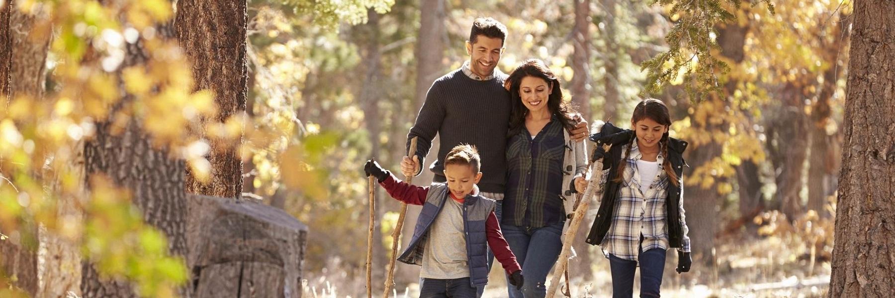 Family of dental patients walking in Lake Roland Park in Towson MD