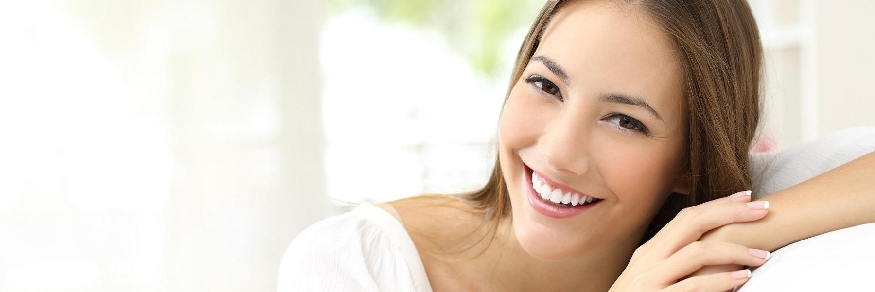 Patient smiling in waiting area at dental office in Towson MD