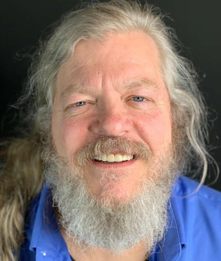 Patient smiling after dental crown and implant procedure in Towson, MD